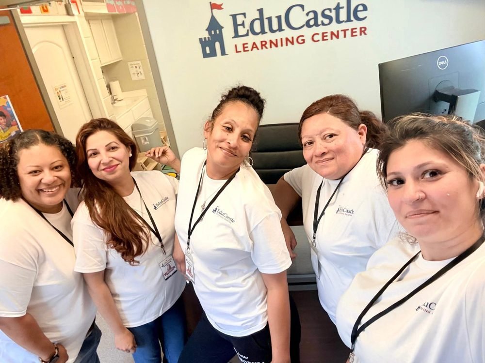 Five EduCastle teachers together at the front office