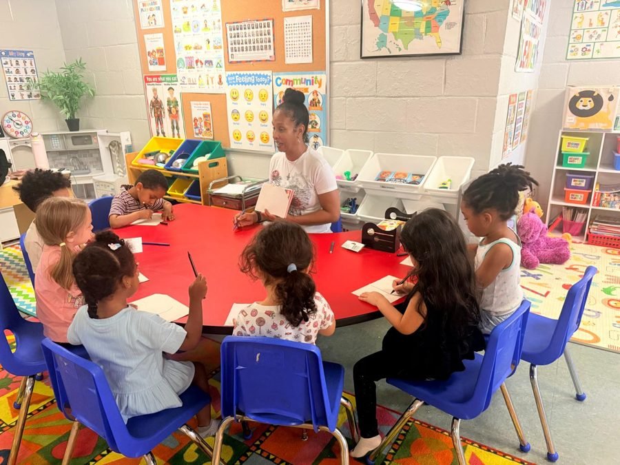 Writing practice at the round table at EduCastle Learning Center