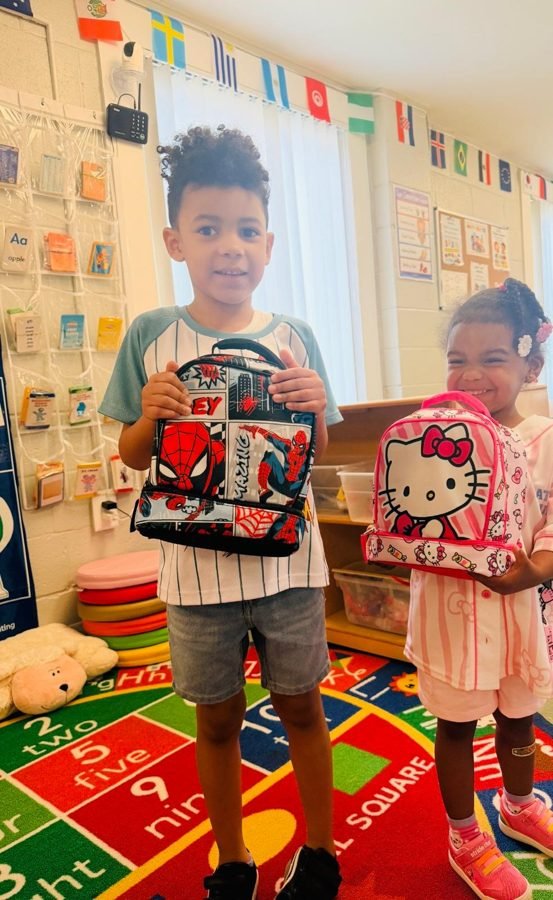 A child with their lunchbox at EduCastle Learning Center