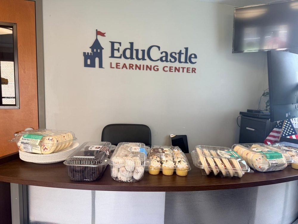 The welcome desk at the EduCastle open house, stacked with treats
