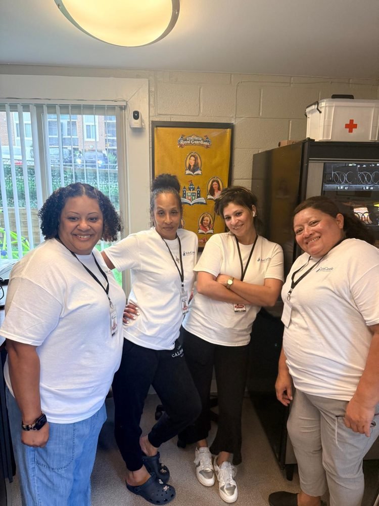 Four of the EduCastle teachers in the front office