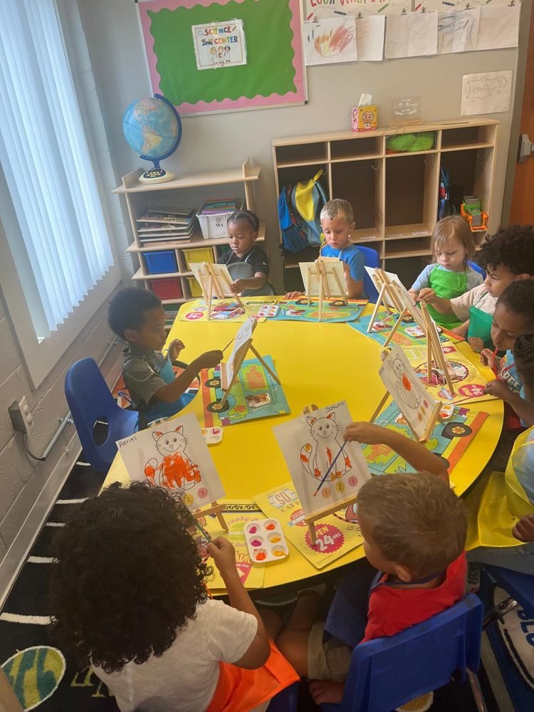 Children painting at easels